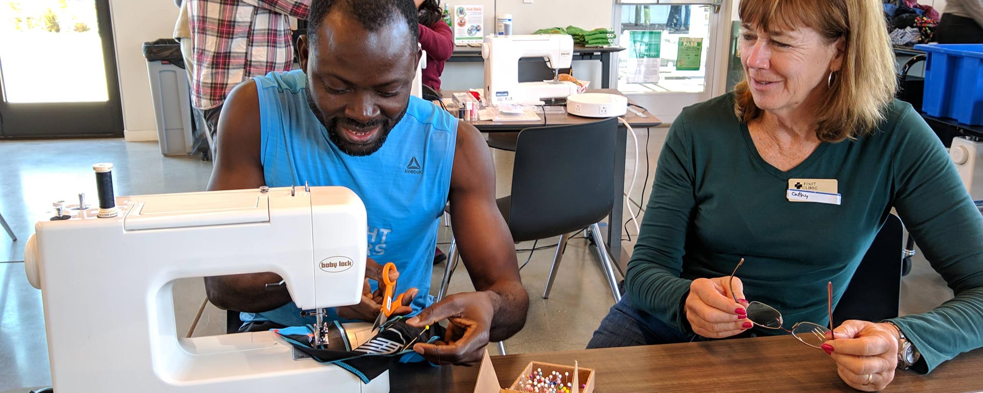 participant and volunteer at a Fixit Clinics in San Mateo County repair sewn and other items to reduce waste